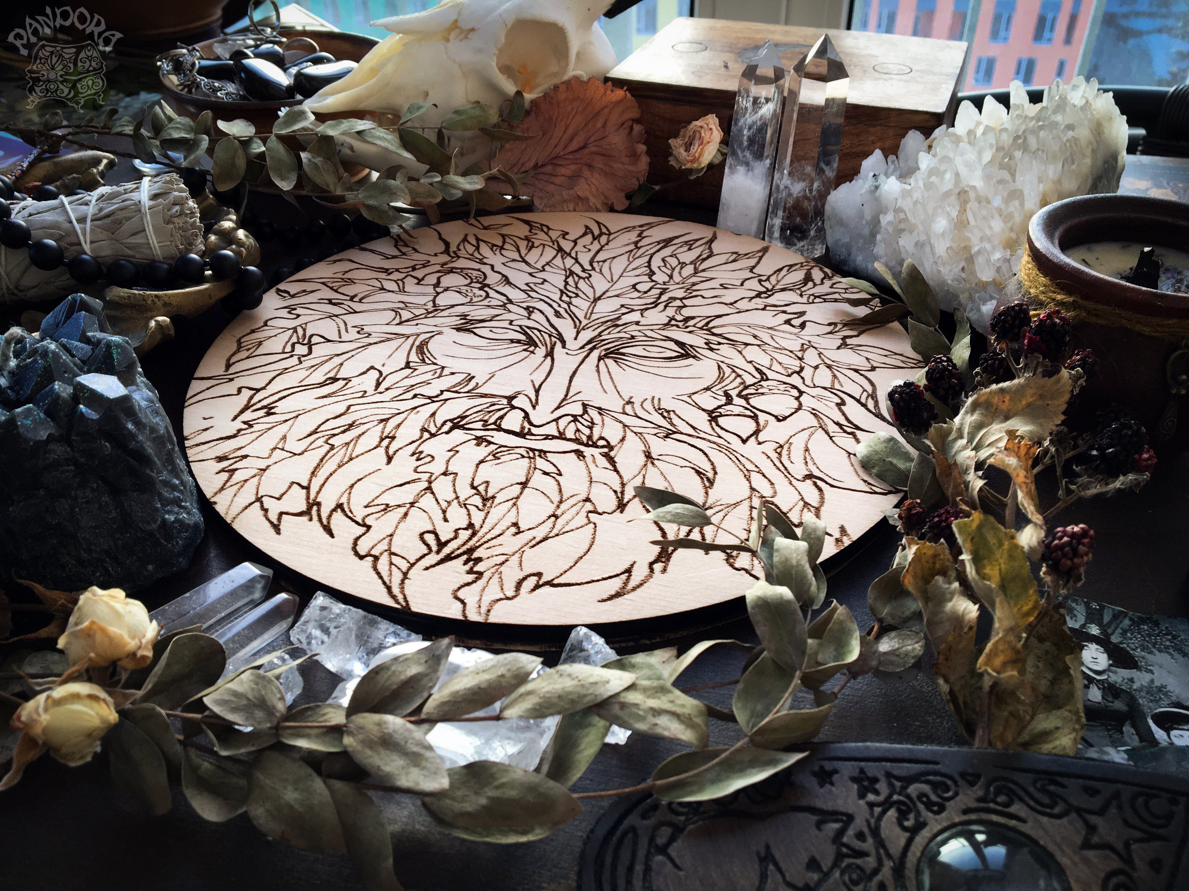 Wooden pentacle with engraving Green Man related to natural vegetative deities. Symbol of rebirth.