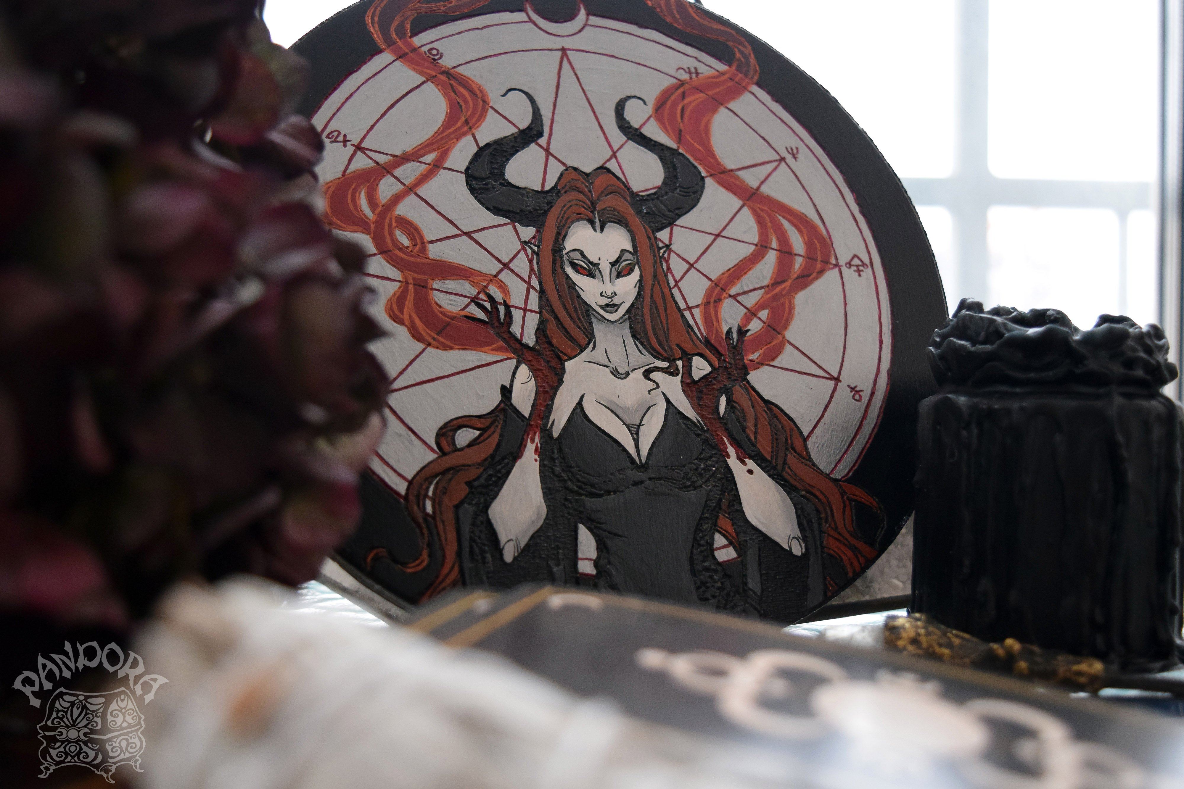 Wooden pentacle with engraving dark goddess Lilith. Often envisioned as a dangerous female demon.