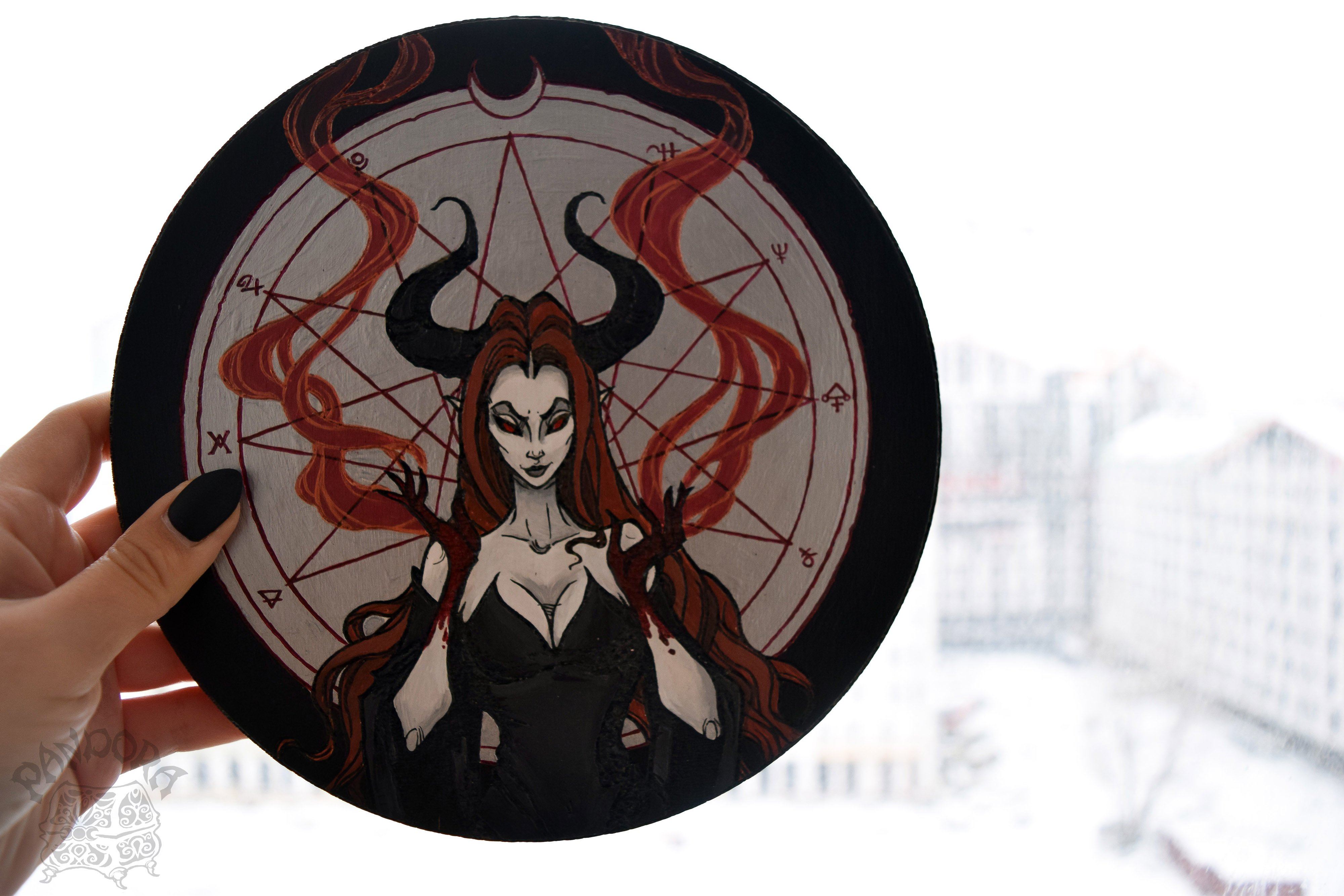 Wooden pentacle with engraving dark goddess Lilith. Often envisioned as a dangerous female demon.