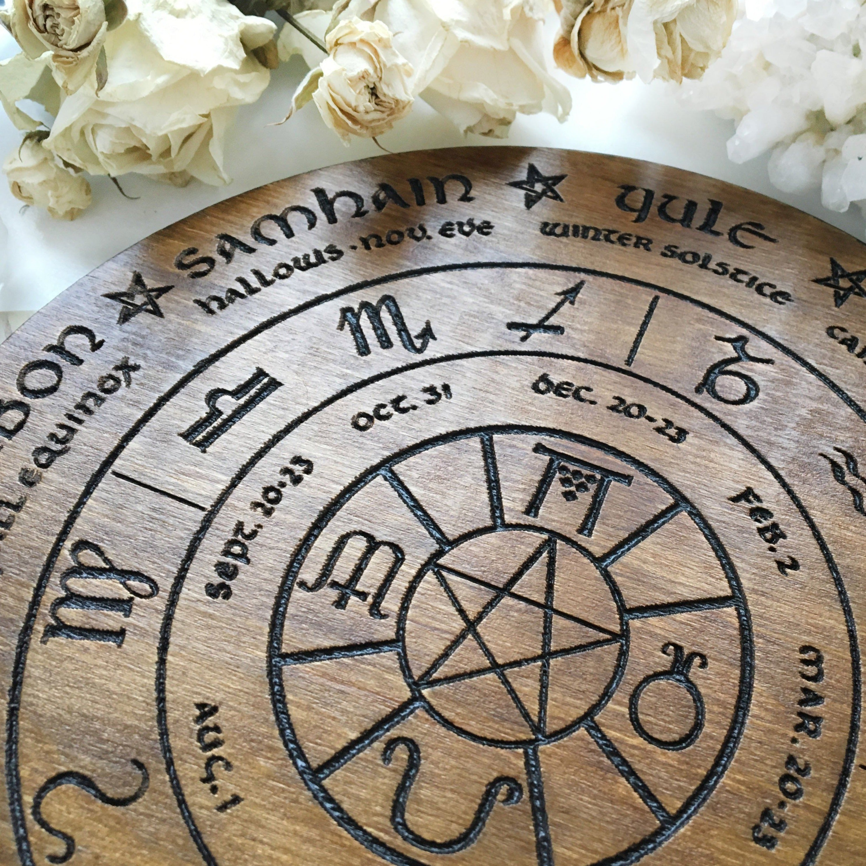Wooden Wheel of the Year - calendar of pagan festivals and seasonal sabbaths: Yule, Imbolc, Ostara, Beltane, Litha, Lammas, Mabon, Samhain.