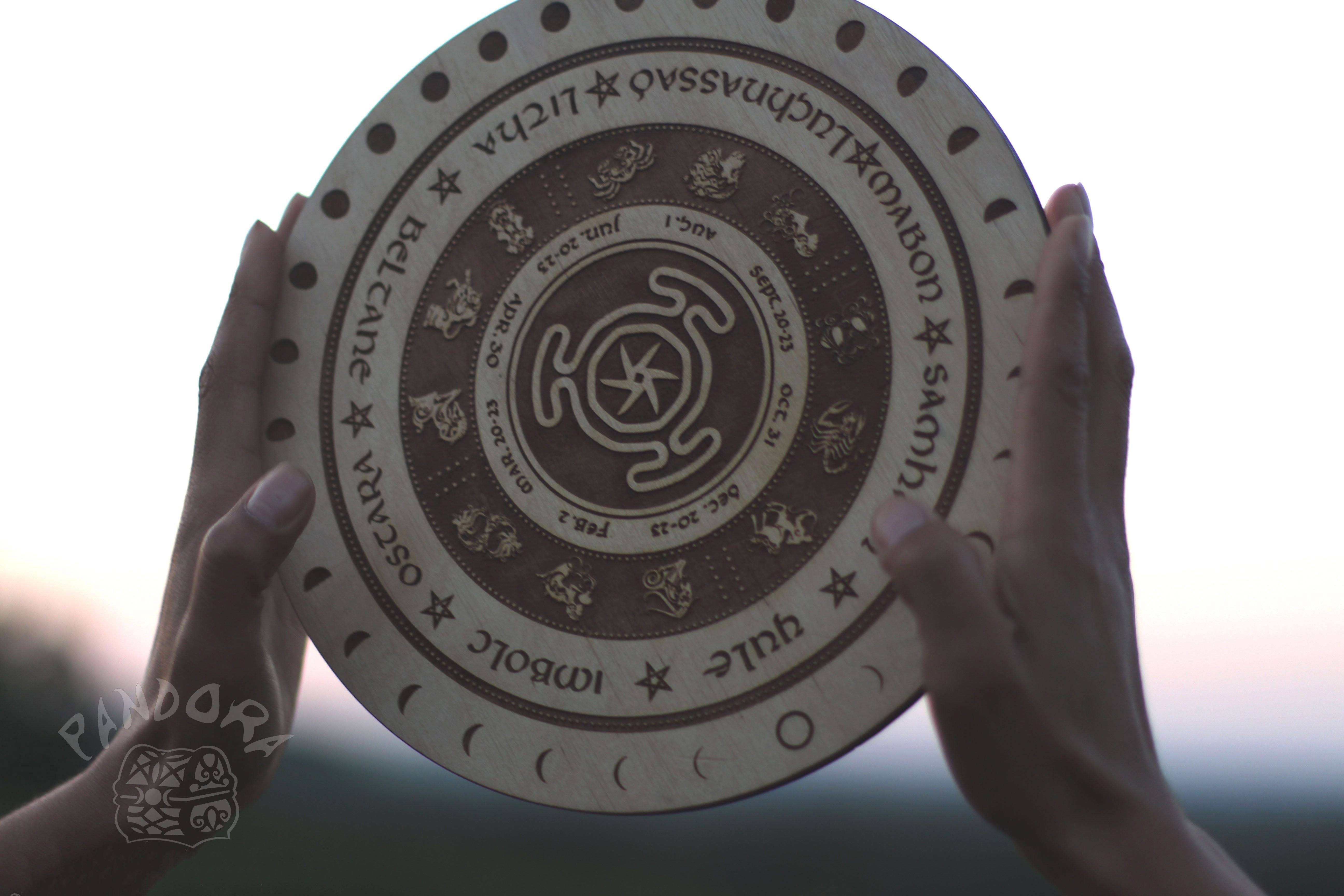 Wooden Wheel of the Year - calendar of pagan festivals and seasonal sabbaths: Yule, Imbolc, Ostara, Beltane, Litha, Lammas, Mabon, Samhain.