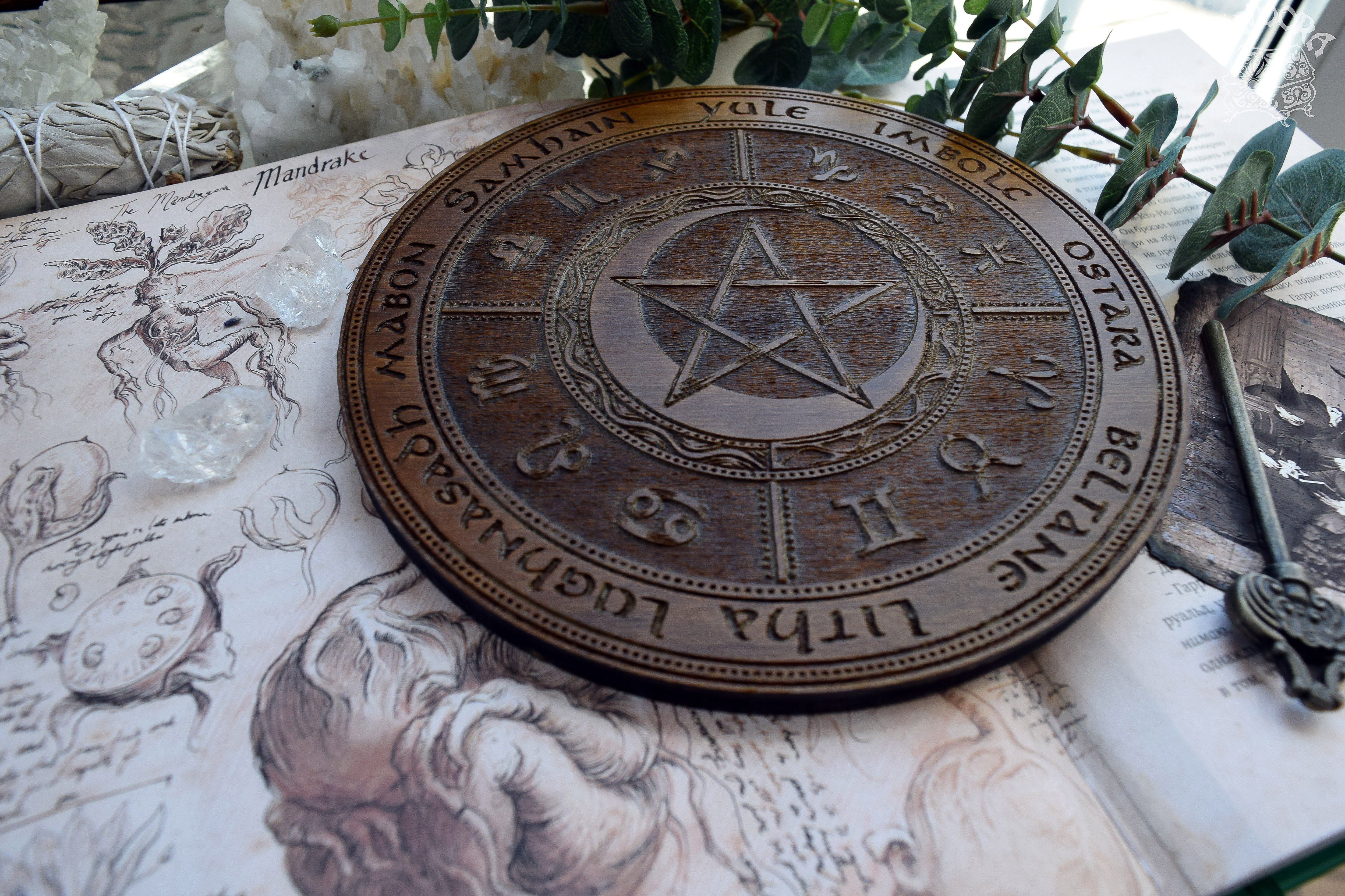 Wooden Wheel of the Year - calendar of pagan festivals and seasonal sabbaths: Yule, Imbolc, Ostara, Beltane, Litha, Lammas, Mabon, Samhain.