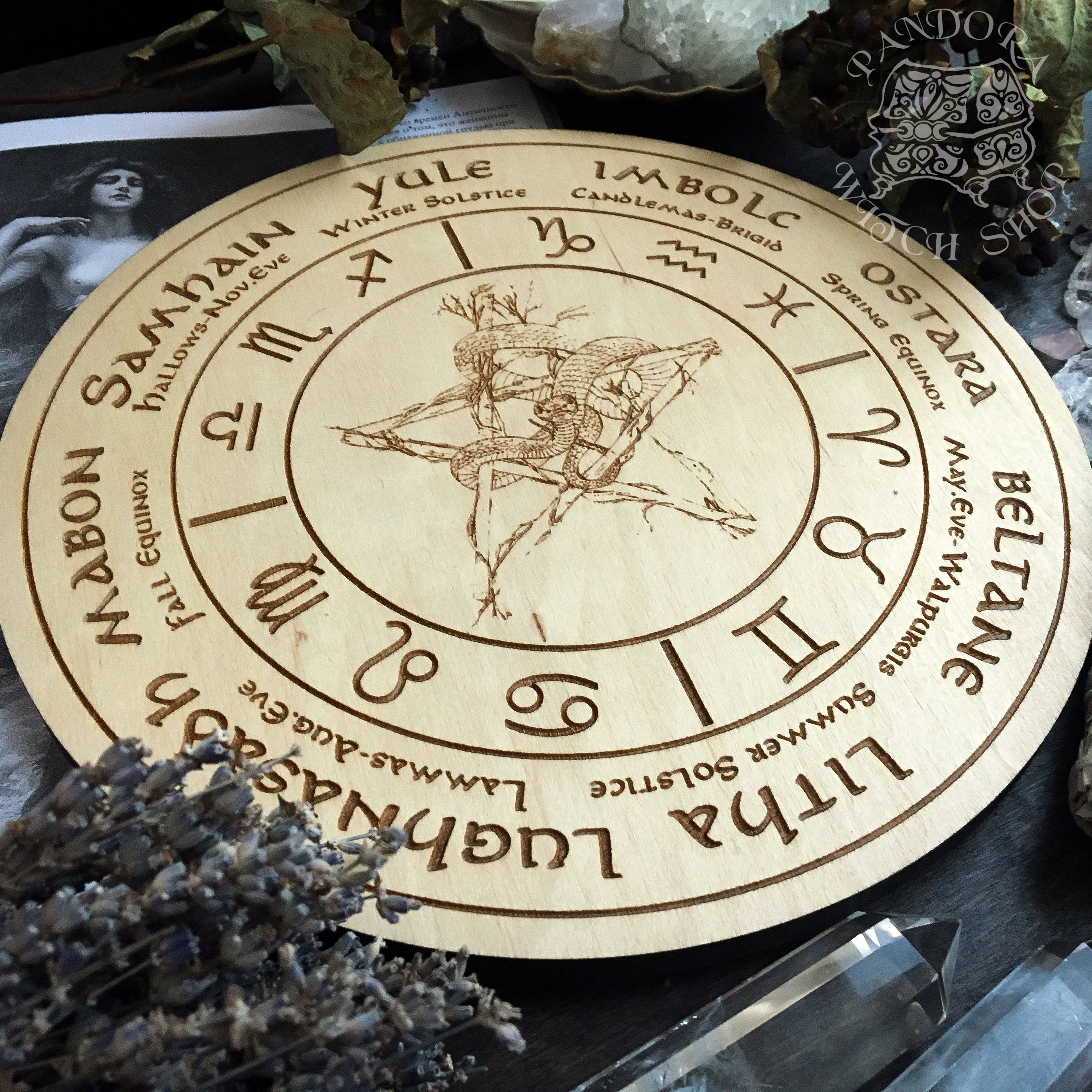 Wooden Wheel of the Year - calendar of pagan festivals and seasonal sabbaths: Yule, Imbolc, Ostara, Beltane, Litha, Lammas, Mabon, Samhain.
