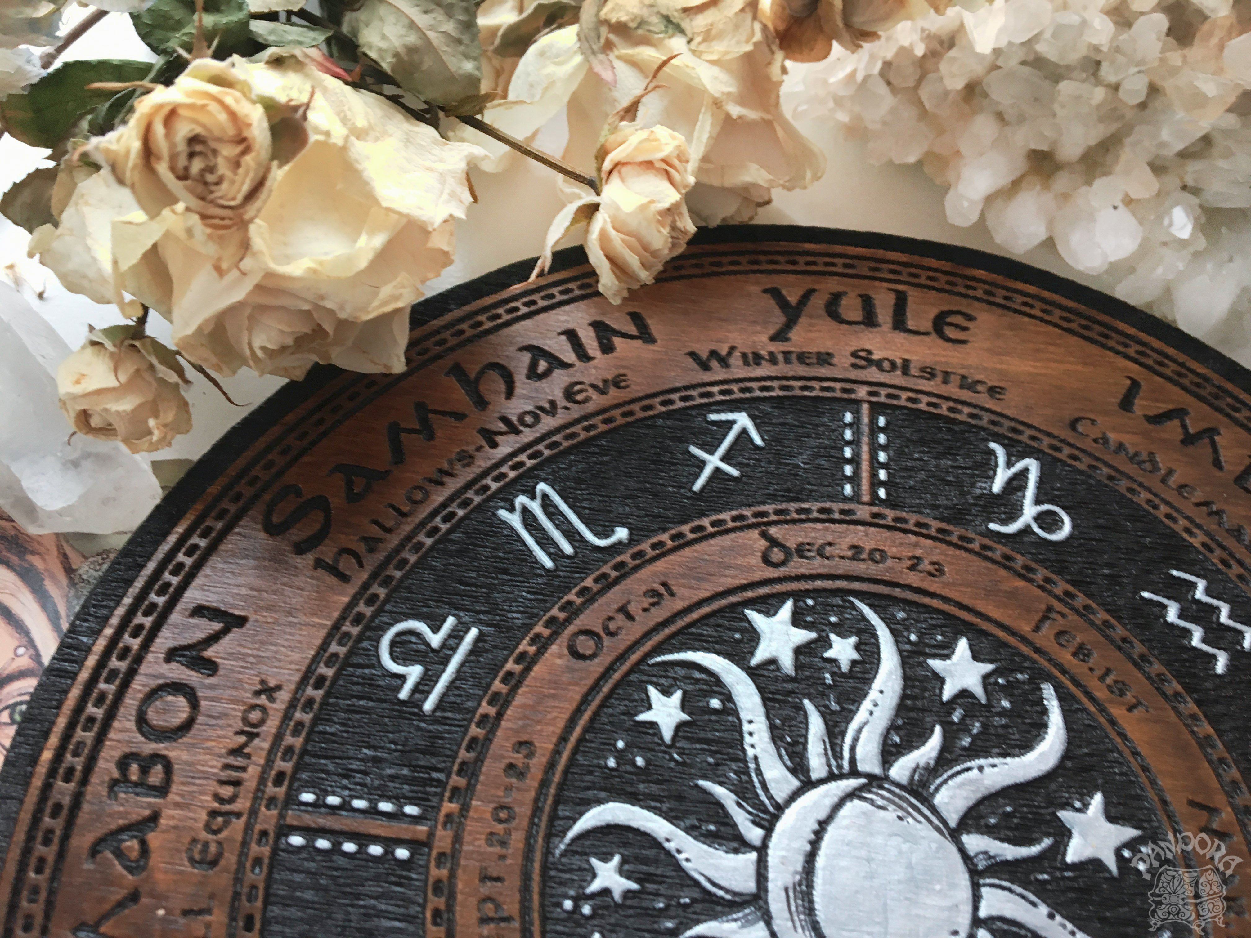Wooden Wheel of the Year - calendar of pagan festivals and seasonal sabbaths: Yule, Imbolc, Ostara, Beltane, Litha, Lammas, Mabon, Samhain.