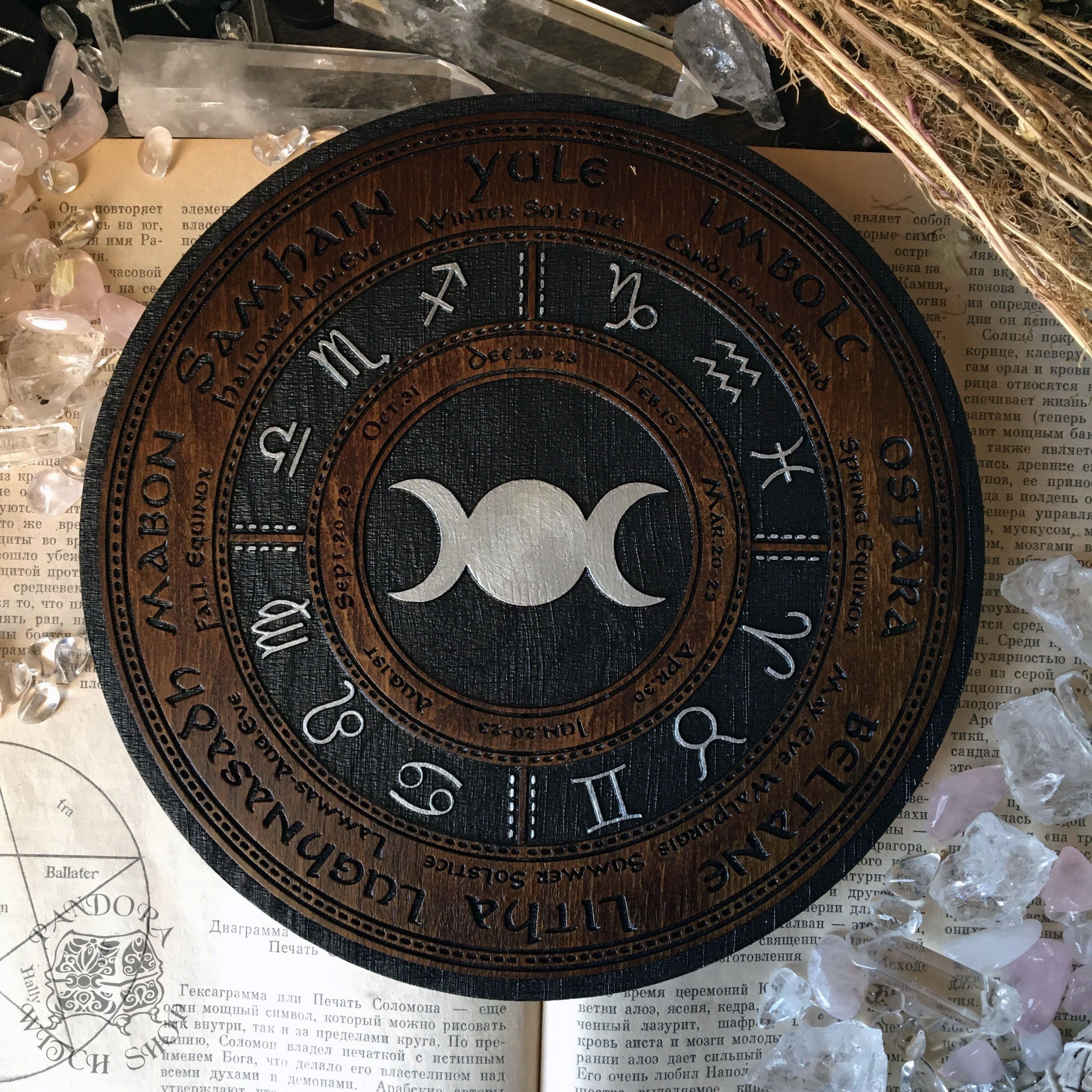 Wooden Wheel of the Year - calendar of pagan festivals and seasonal sabbaths: Yule, Imbolc, Ostara, Beltane, Litha, Lammas, Mabon, Samhain.