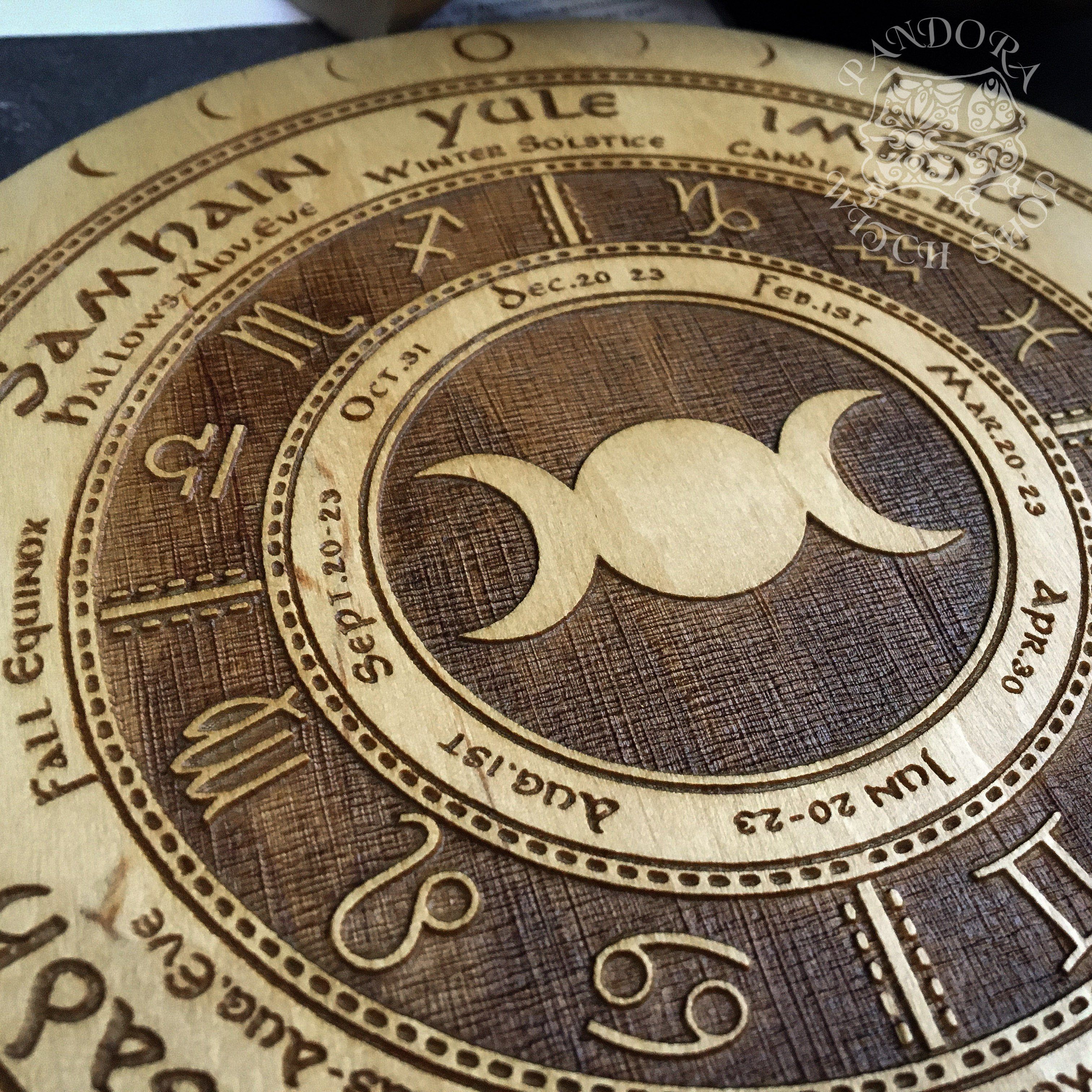 Wooden Wheel of the Year - calendar of pagan festivals and seasonal sabbaths: Yule, Imbolc, Ostara, Beltane, Litha, Lammas, Mabon, Samhain.