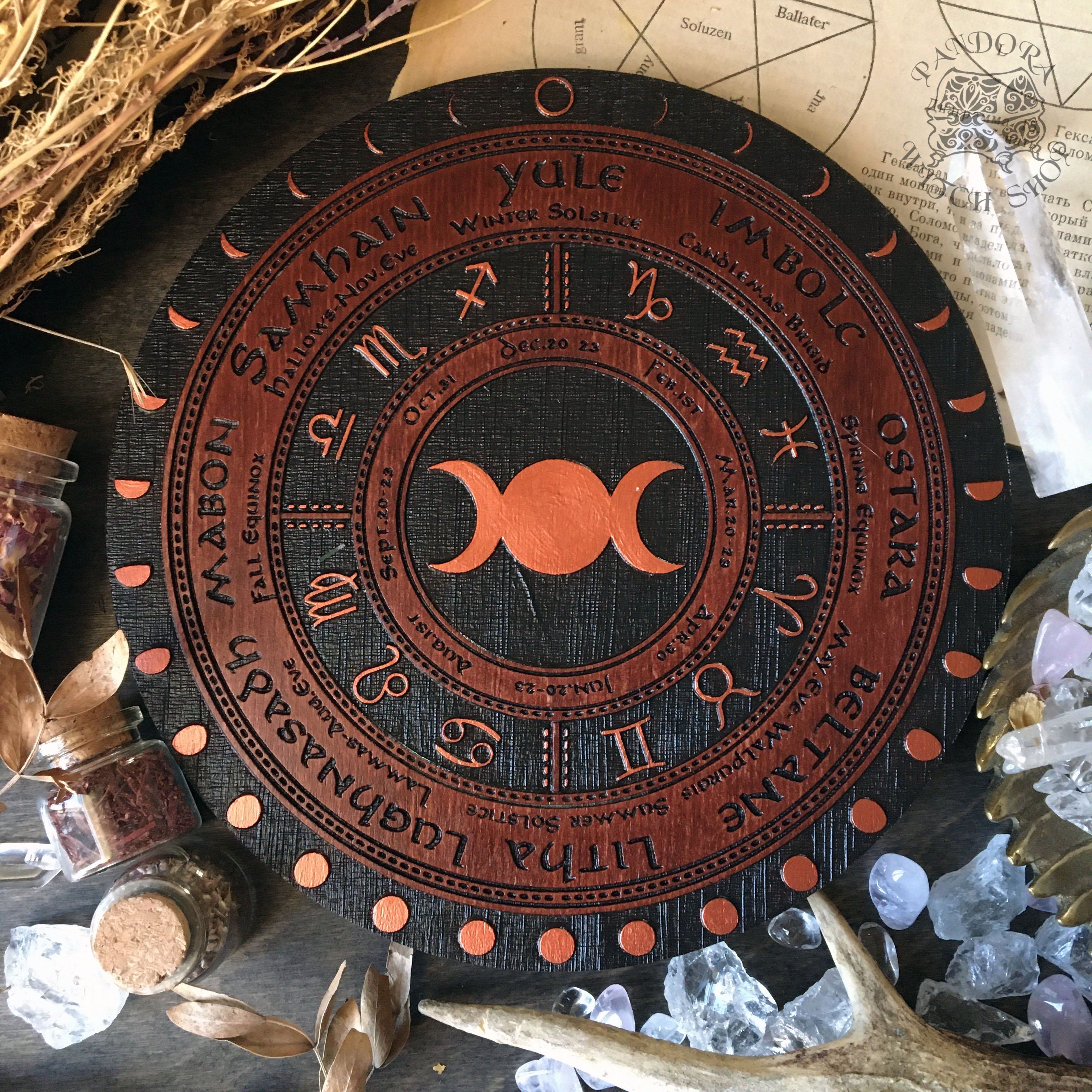 Wooden Wheel of the Year - calendar of pagan festivals and seasonal sabbaths: Yule, Imbolc, Ostara, Beltane, Litha, Lammas, Mabon, Samhain. 