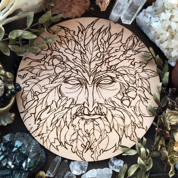 Wooden pentacle with engraving Green Man related to natural vegetative deities. Symbol of rebirth.