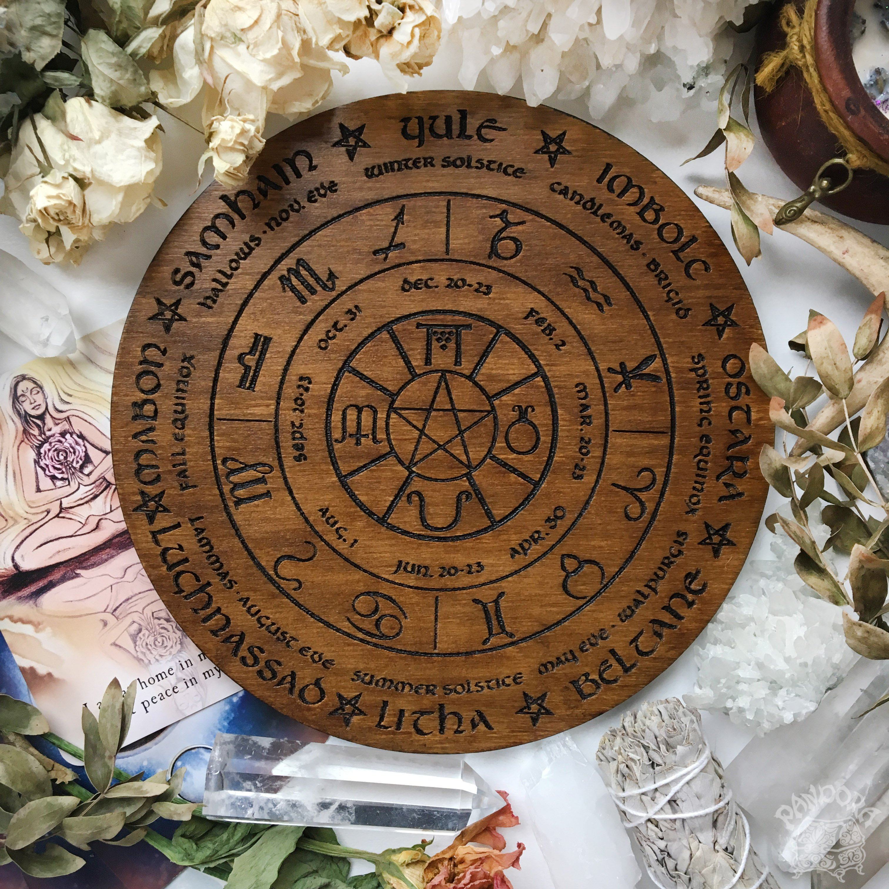 Wooden Wheel of the Year - calendar of pagan festivals and seasonal sabbaths: Yule, Imbolc, Ostara, Beltane, Litha, Lammas, Mabon, Samhain. 