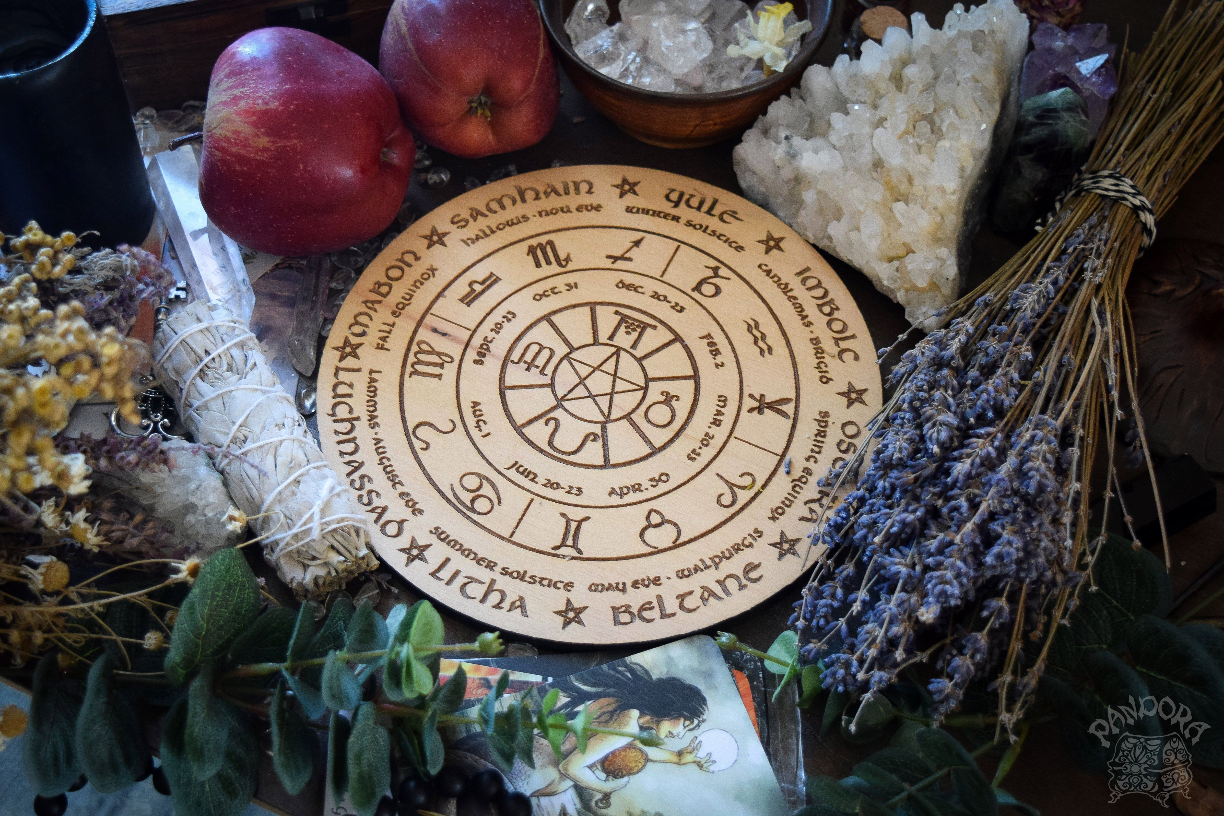 Wooden Wheel of the Year - calendar of pagan festivals and seasonal sabbaths: Yule, Imbolc, Ostara, Beltane, Litha, Lammas, Mabon, Samhain. 