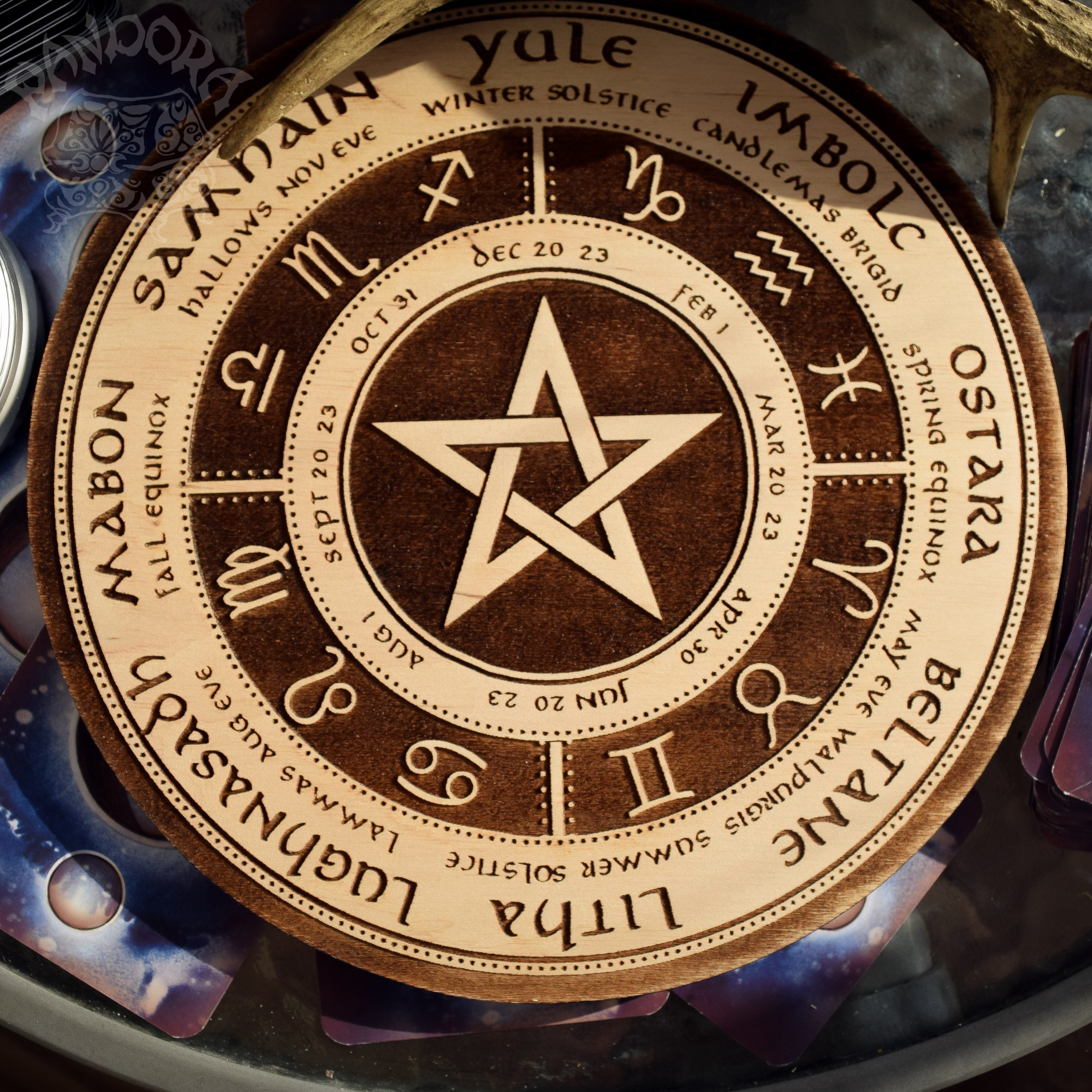 Wooden Wheel of the Year - calendar of pagan festivals and seasonal sabbaths: Yule, Imbolc, Ostara, Beltane, Litha, Lammas, Mabon, Samhain. 