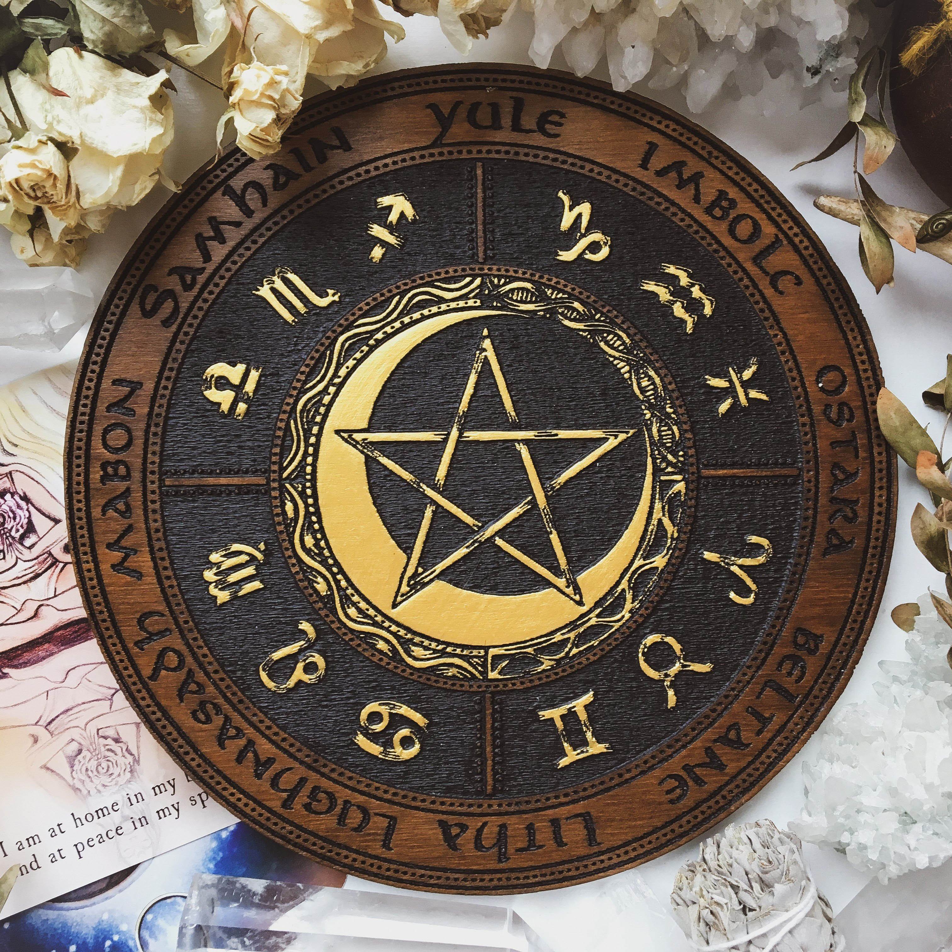 Wooden Wheel of the Year - calendar of pagan festivals and seasonal sabbaths: Yule, Imbolc, Ostara, Beltane, Litha, Lammas, Mabon, Samhain. 