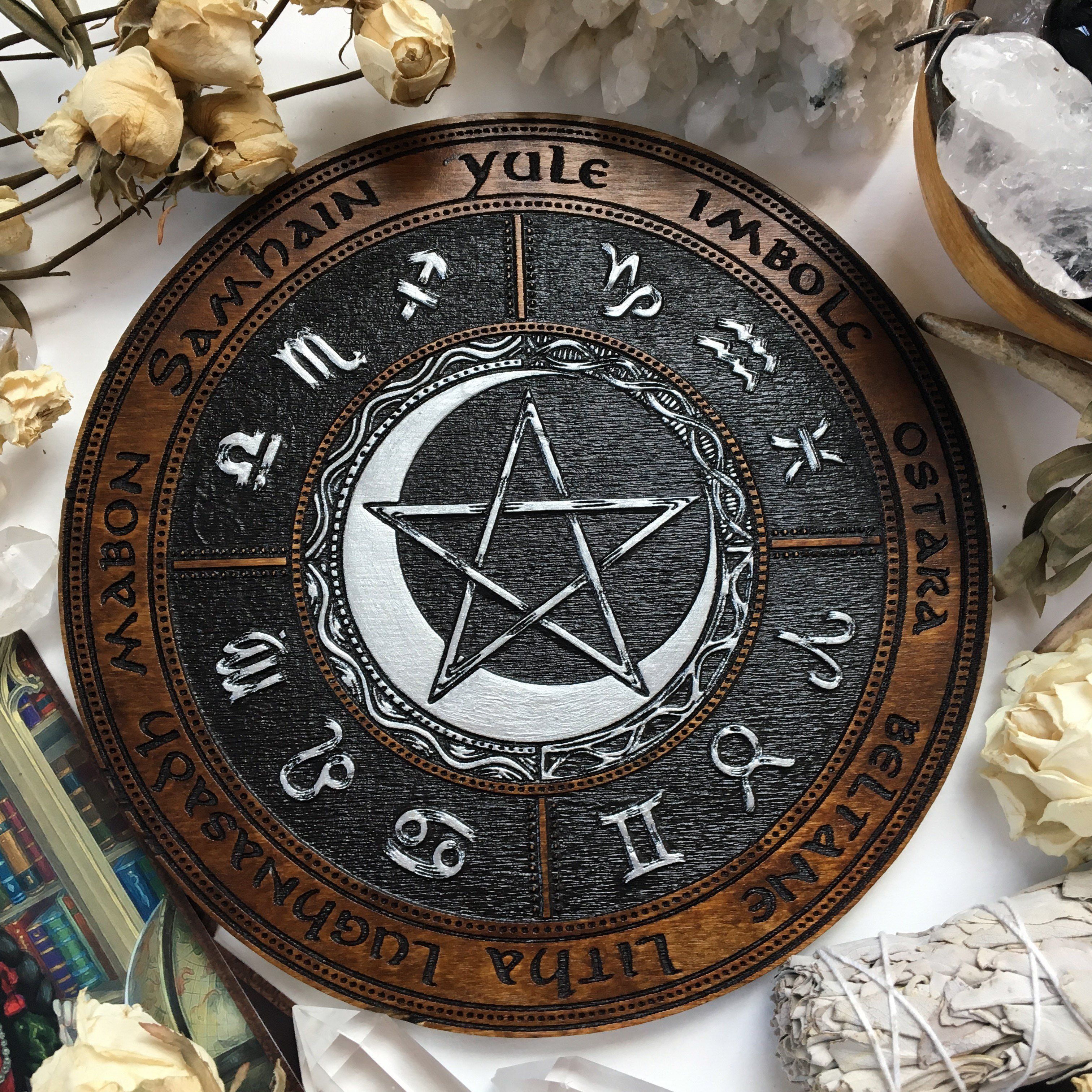 Wooden Wheel of the Year - calendar of pagan festivals and seasonal sabbaths: Yule, Imbolc, Ostara, Beltane, Litha, Lammas, Mabon, Samhain. 