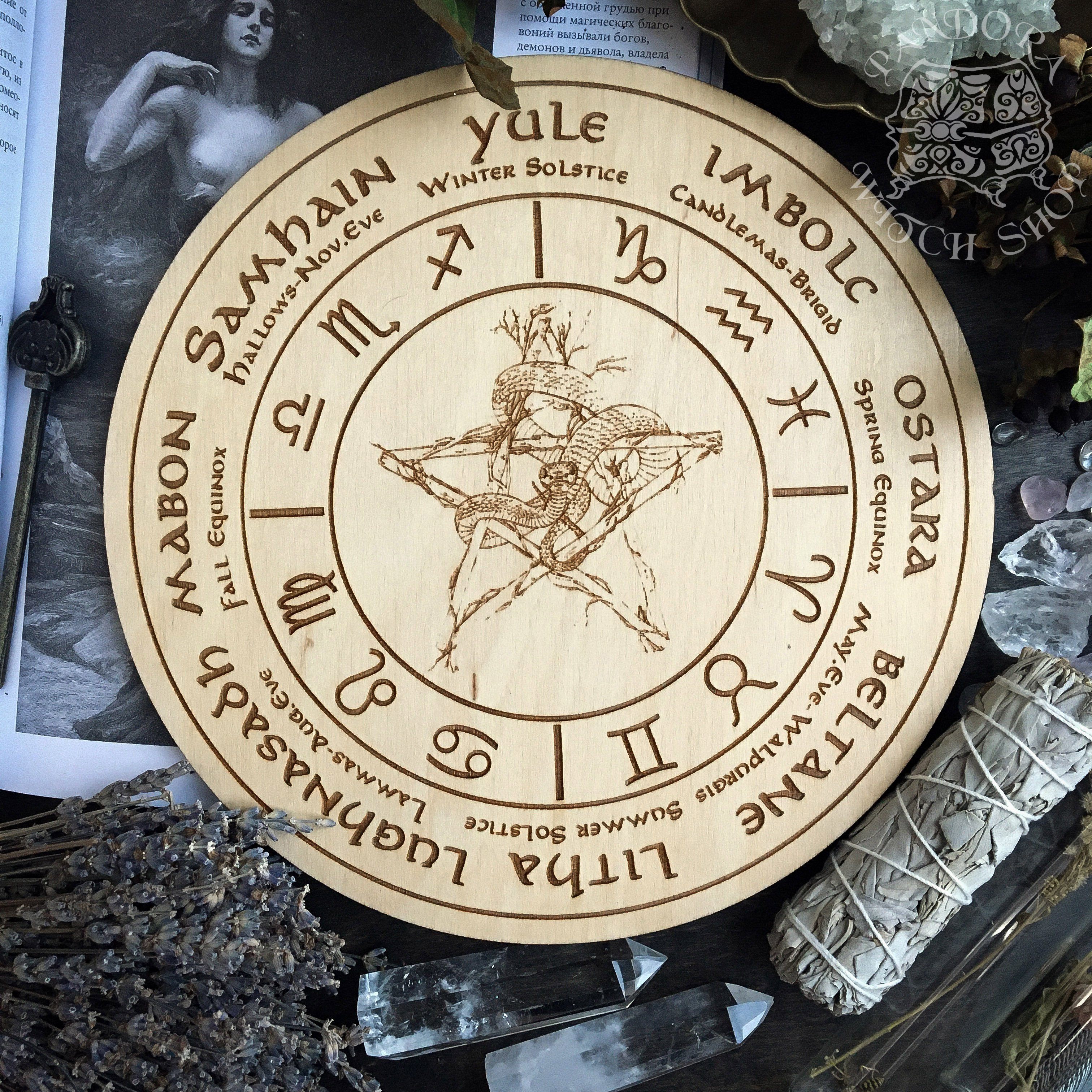 Wooden Wheel of the Year - calendar of pagan festivals and seasonal sabbaths: Yule, Imbolc, Ostara, Beltane, Litha, Lammas, Mabon, Samhain. 