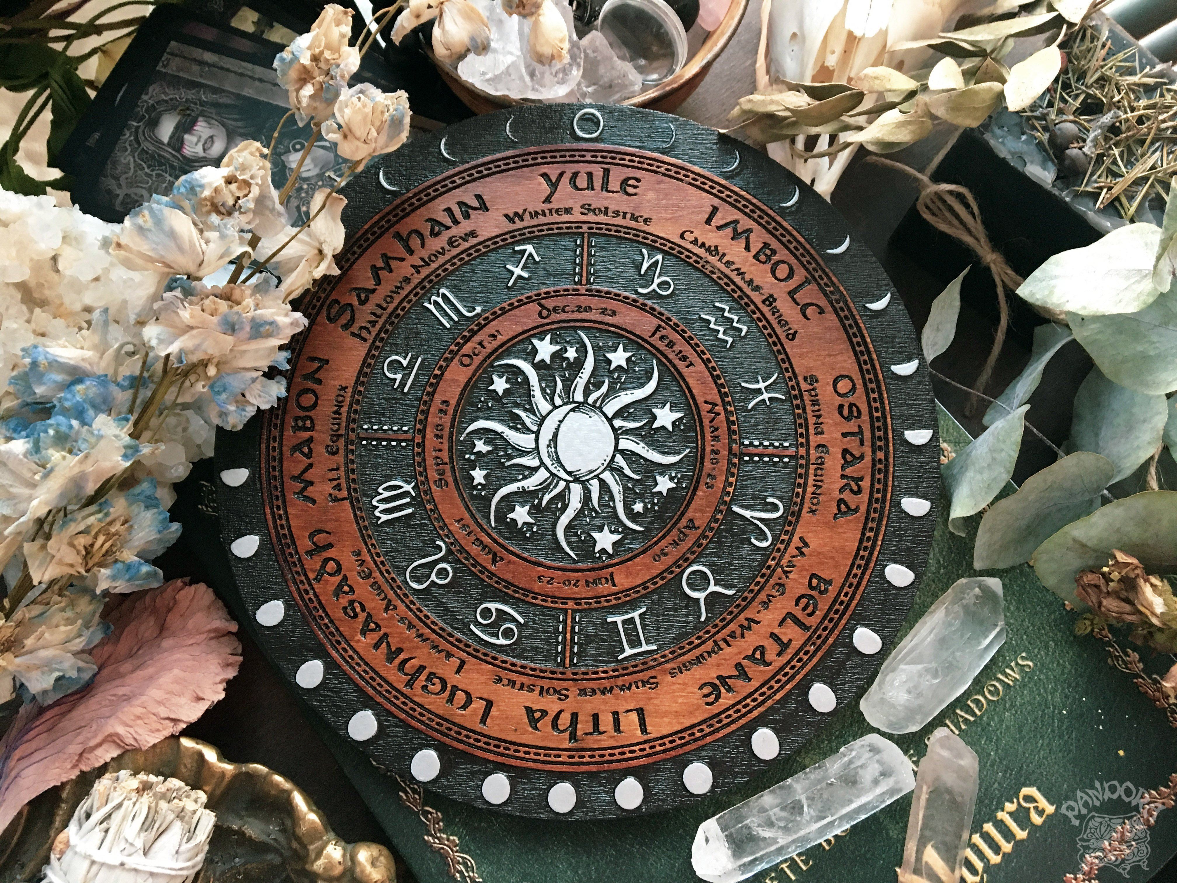 Wooden Wheel of the Year - calendar of pagan festivals and seasonal sabbaths: Yule, Imbolc, Ostara, Beltane, Litha, Lammas, Mabon, Samhain. 