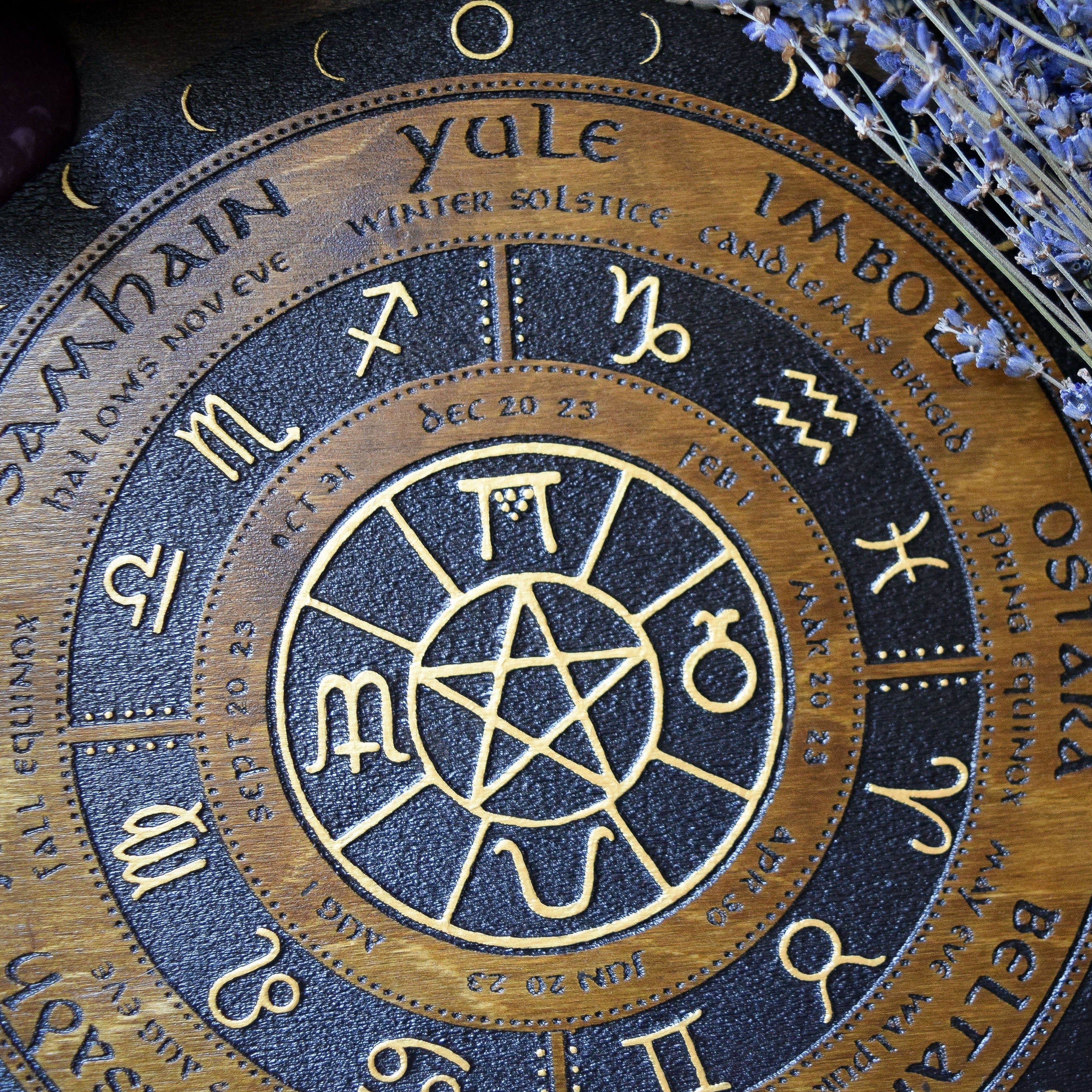 Wooden Wheel of the Year - calendar of pagan festivals and seasonal sabbaths: Yule, Imbolc, Ostara, Beltane, Litha, Lammas, Mabon, Samhain. 