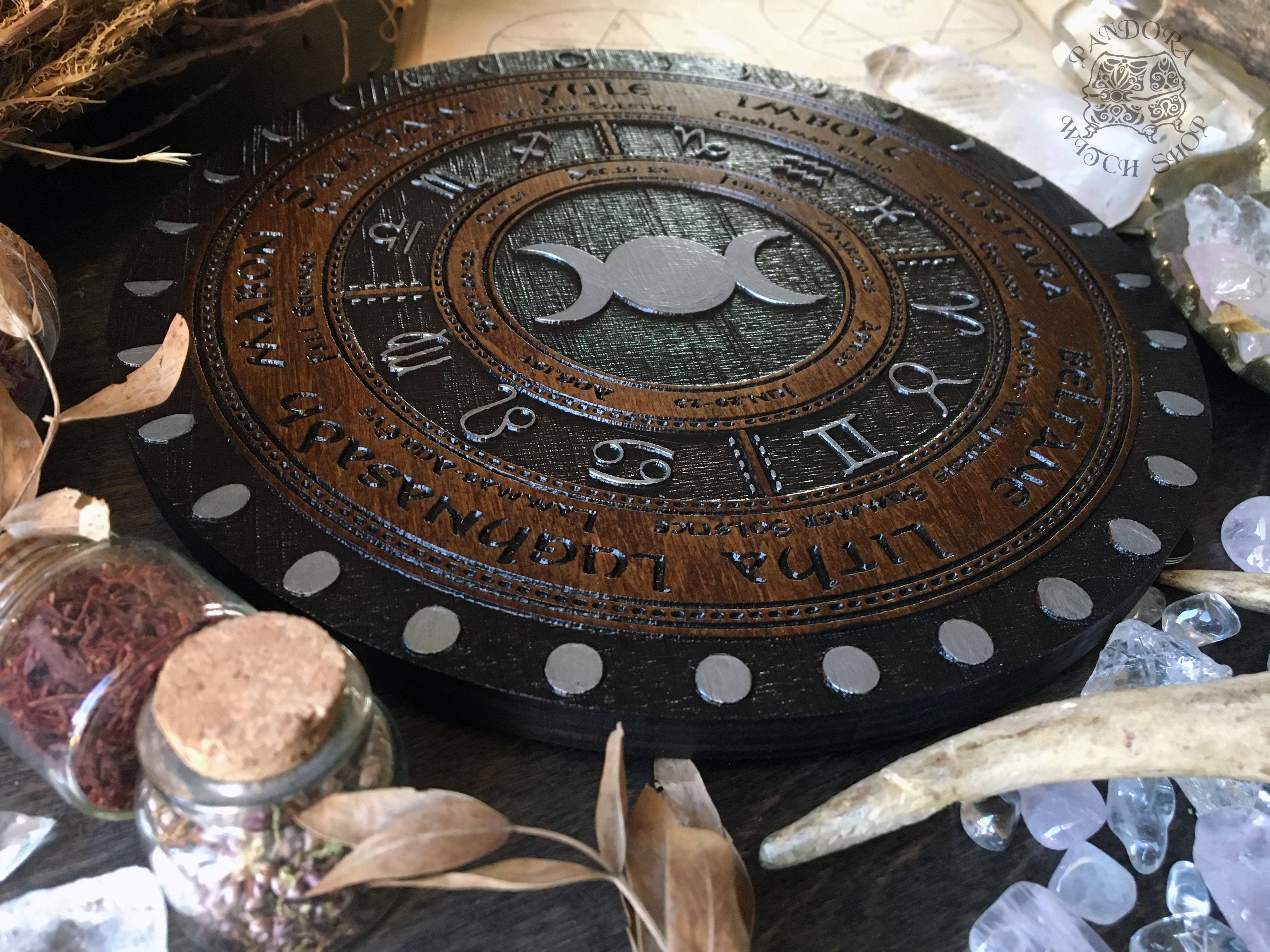 Wooden Wheel of the Year - calendar of pagan festivals and seasonal sabbaths: Yule, Imbolc, Ostara, Beltane, Litha, Lammas, Mabon, Samhain. 