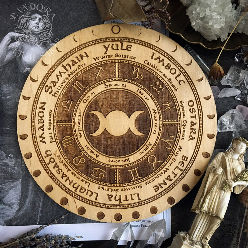 Wooden Wheel of the Year - calendar of pagan festivals and seasonal sabbaths: Yule, Imbolc, Ostara, Beltane, Litha, Lammas, Mabon, Samhain. 
