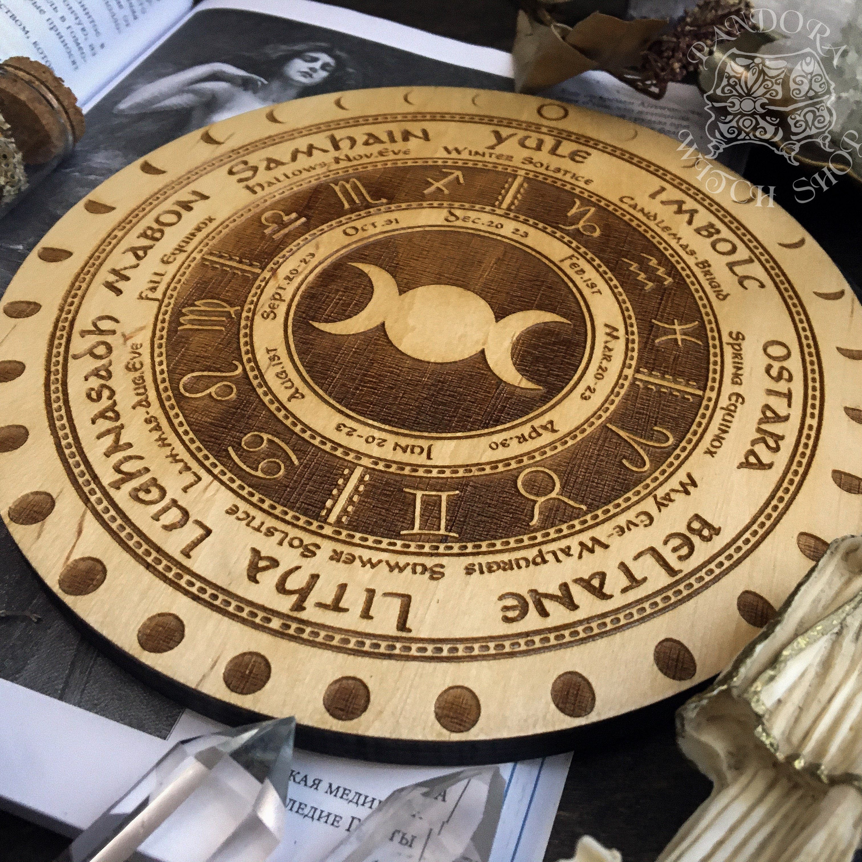 Wooden Wheel of the Year - calendar of pagan festivals and seasonal sabbaths: Yule, Imbolc, Ostara, Beltane, Litha, Lammas, Mabon, Samhain. 